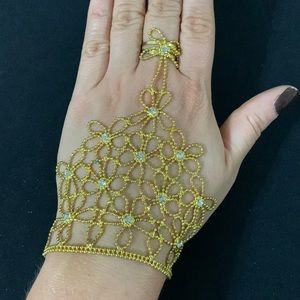 Hand bracelet with attached ring